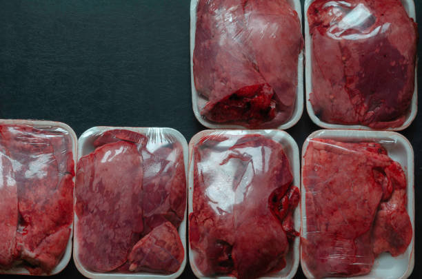 istock Raw portioned packaged beef lungs on a dark background. 1264839680