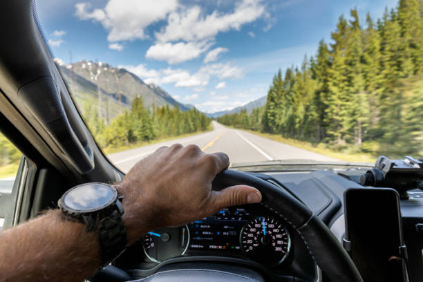 POV Video of Car driving on Empty Road Towards Moraine Lake in Banff National Park, Canada POV Video of Car driving on Empty Road Towards Moraine Lake in Banff National Park, Canada car point of view stock pictures, royalty-free photos & images