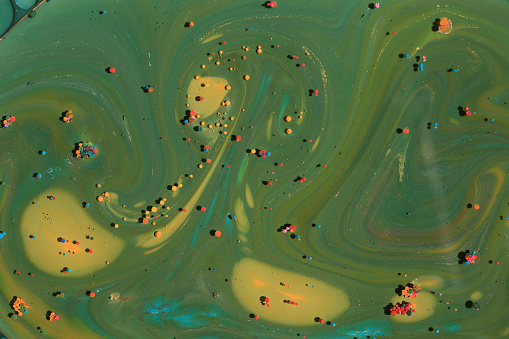 green, yellow, orange, red acrylic paints abstract under oil