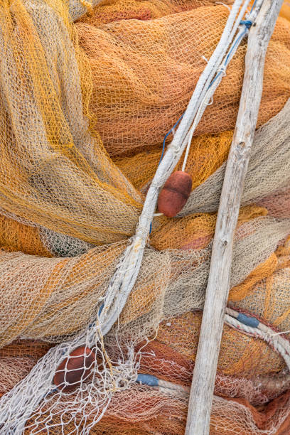 istock Fishing nets with trawlers and floats 1264841712