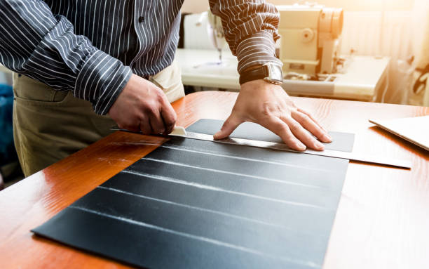 istock Designer tailor sew seat covers. Man use sewing machine for his work. 1264842179
