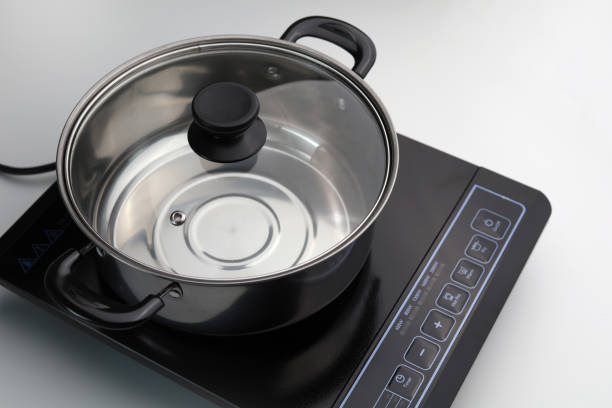 istock High Angle View Cooking Pot On Induction Cooktop 1264842346