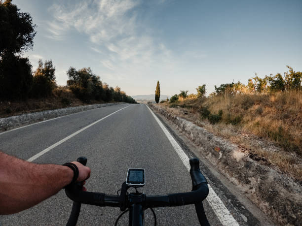 Riding a road bicycle in Tuscany on summer stock photo