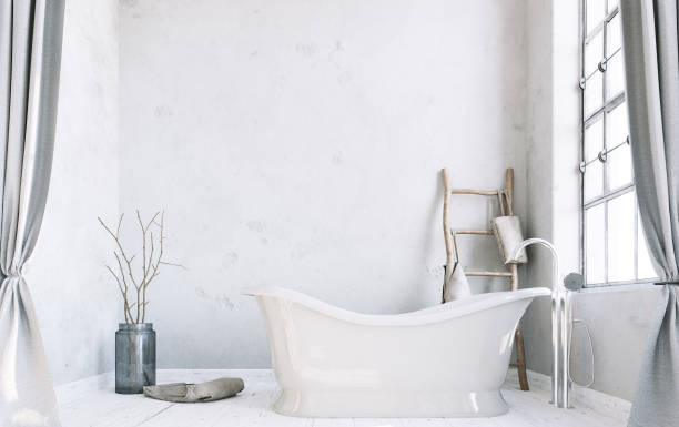 istock Classic bathroom and bathtub with big windows, minimalistic white interior design. 1264843377