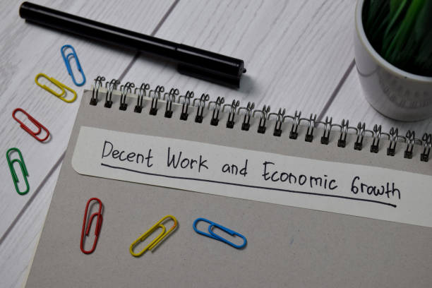 istock Decent Work and Economic Growth write on sticky notes isolated on office desk 1264844123