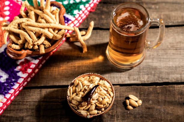 Beer jar with delicious Mexican snacks