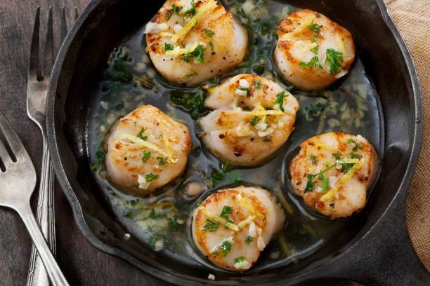 istock Scallops Poached in a Butter and Garlic Sauce 1264845350