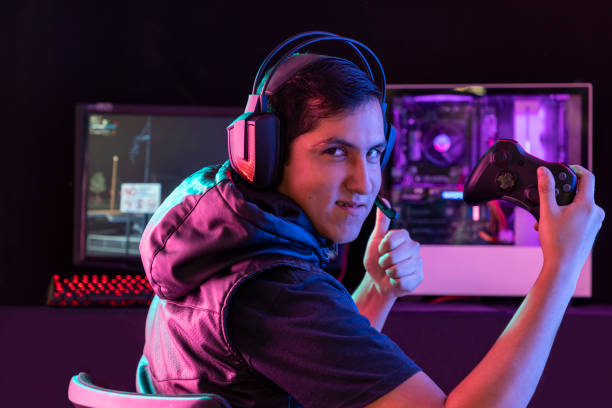 istock Young man playing videogames with different facial expressions 1264846834