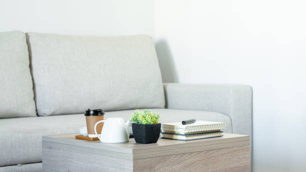 istock Plastic plants placed on wood table in living room 1264847957