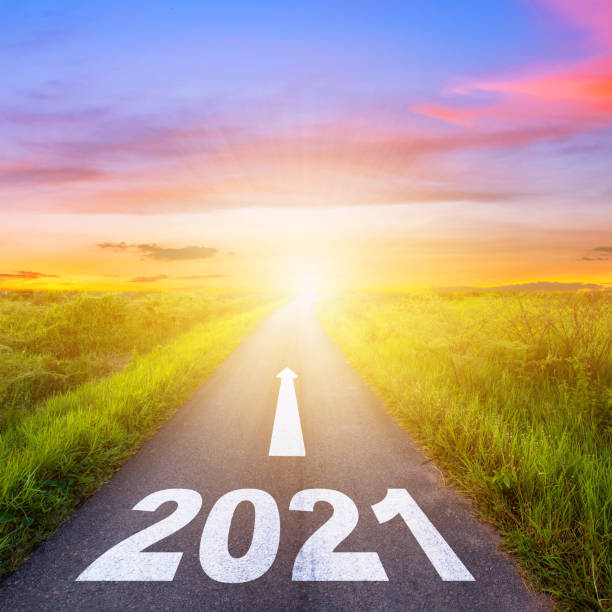 New Year Goals Concept : Empty asphalt road sunset and Happy New Year 2021. New Year Goals Concept : Empty asphalt road sunset and Happy New Year 2021. new normal concept stock pictures, royalty-free photos & images