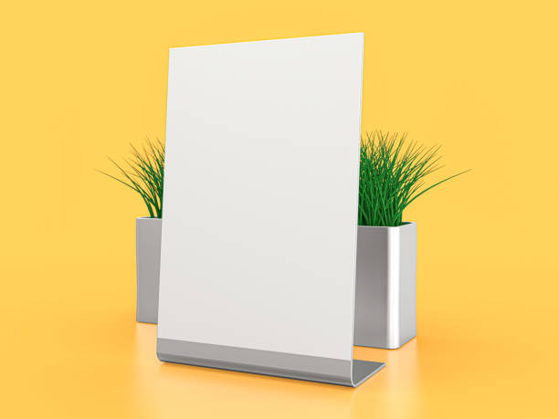 istock Blank paper Table Tent. Mockup on yellow background. 3D illustration. 1264852239