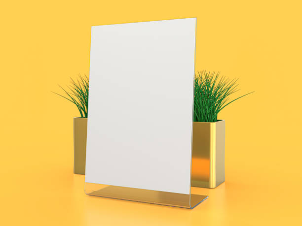 istock Blank paper Table Tent. Mockup on yellow background. 3D illustration. 1264852241