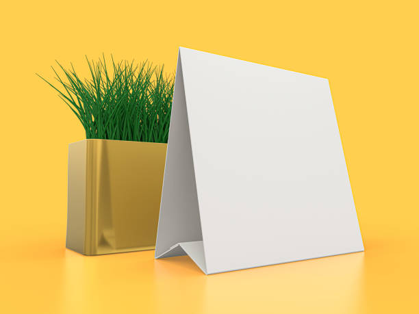 istock Blank paper Table Tent. Mockup on yellow background. 3D illustration. 1264852243