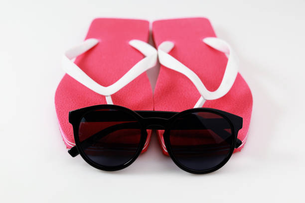istock flip-flop sandals and sunglasses on white background 1264853179