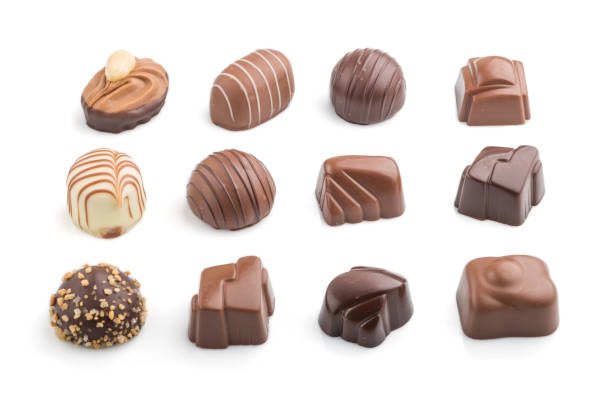 istock Different chocolate candies isolated on white background. side view, close up. 1264859069