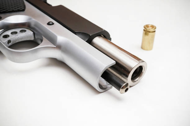 istock 9mm pistol bullet and handgun isolated on white 1264860127