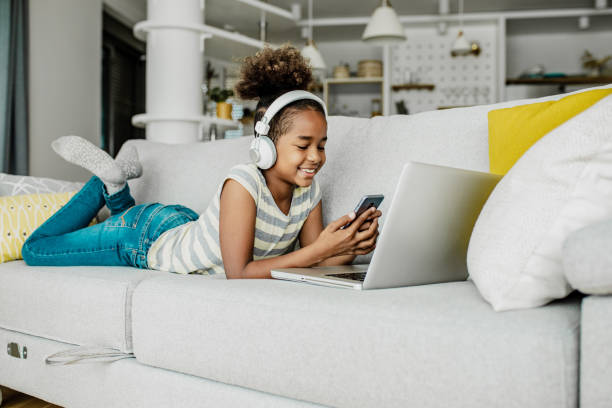 istock Young girl at home using laptop 1264860630