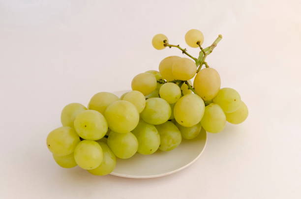istock Bunch with fresh ripe white grapes, ready to eat 1264861724