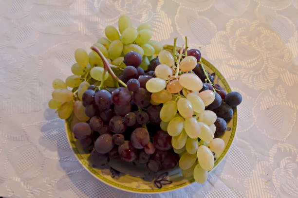 istock Fresh ripe white, black and pink grapes, ready to eat 1264861777