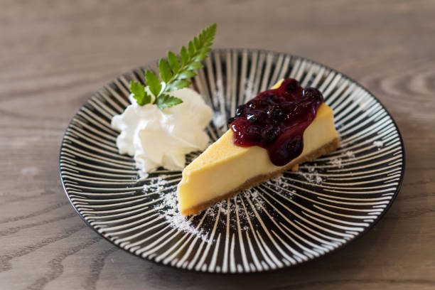 istock blueberry New York cheesecake on wooden table 1264861831