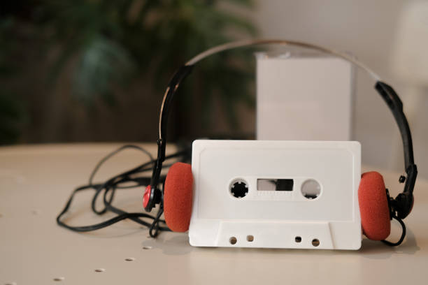 istock White cassette tape with red vintage headphones 1264862646