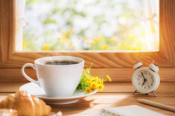 istock Coffee and flower for breakfast placed by the window with morning sunlight 1264864064