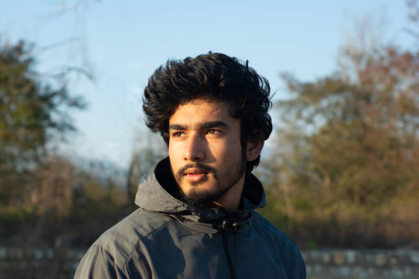 istock handsome young man portrait in evening 1264865098