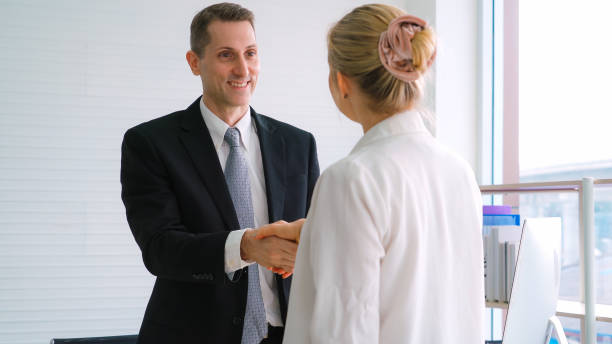 istock Business people handshake in corporate office 1264865208