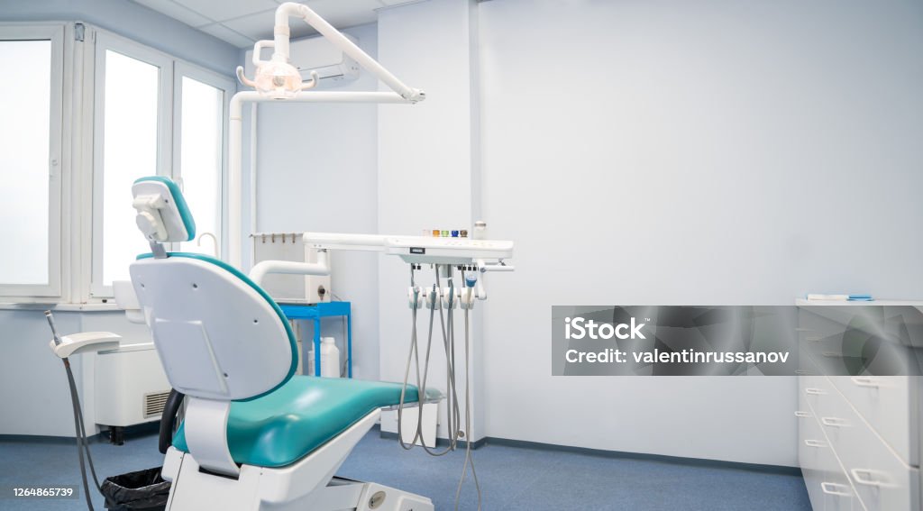 Modern dental practice, dental chair and other accessories used by dentists. Modern dental practice. Dental chair and other accessories used by dentists. Dentist's Office Stock Photo