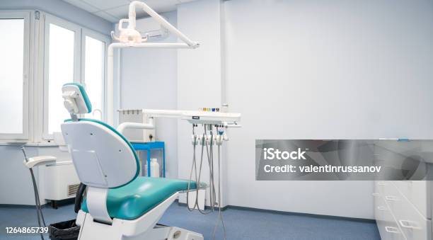 Modern Dental Practice Dental Chair And Other Accessories Used By Dentists Stock Photo - Download Image Now