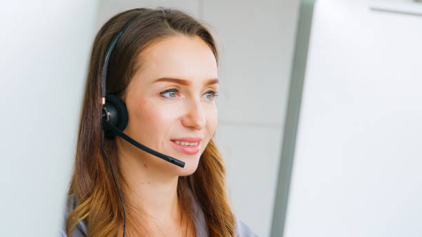 istock Business people wearing headset working in office 1264865987