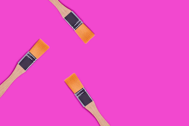 istock Paint brushes on a purple background. 1264866060
