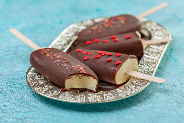 istock Homemade ice cream on a stick in dark chocolate icing. 1264866935