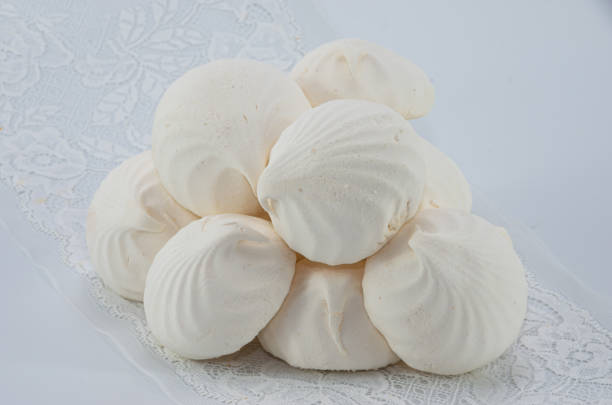 istock Delicious white marshmallows on a white background, white 1264867069