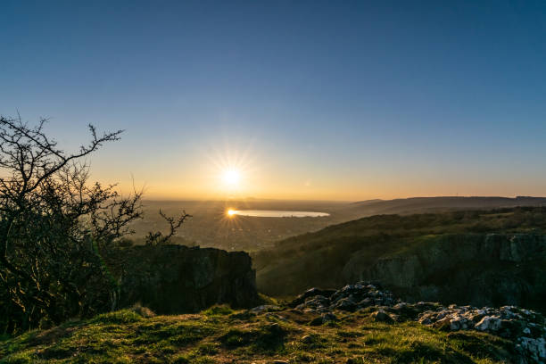 View from cheddar gorge at sunset View over the reservoir from the top of cheddar gorge at sunset cheddar gorge stock pictures, royalty-free photos & images