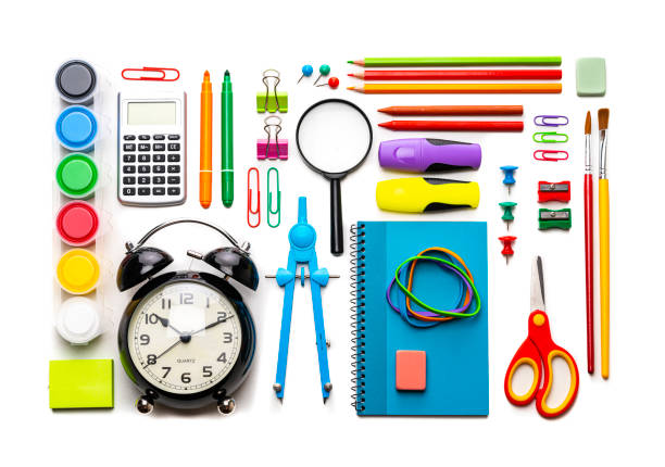 Multicolored school supplies shot from above on white background.