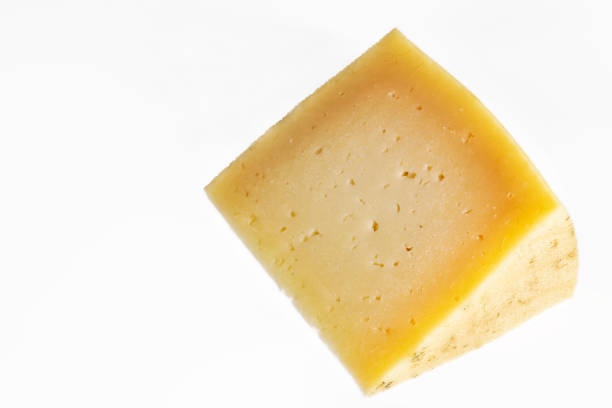 istock portion of cured manchego cheese on white background. Horizontal shot 1264874883