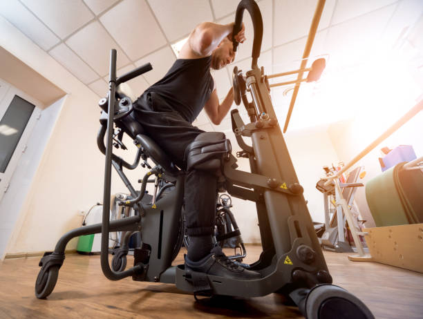 istock Disabled man training in the gym. Rehabilitation center 1264877210