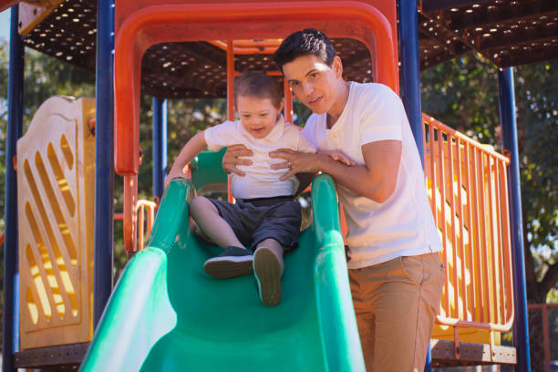 istock Father and son in a publick park. 1264882004