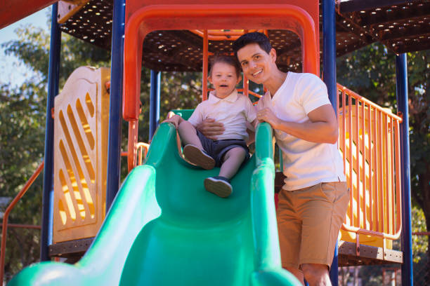 istock Father and son in a publick park. 1264882187