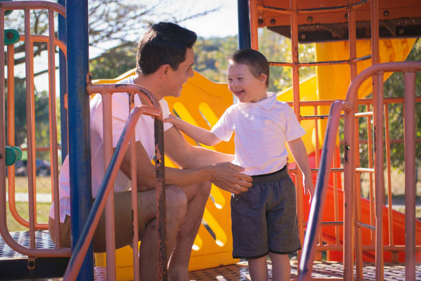 istock Father and son in a publick park. 1264882200