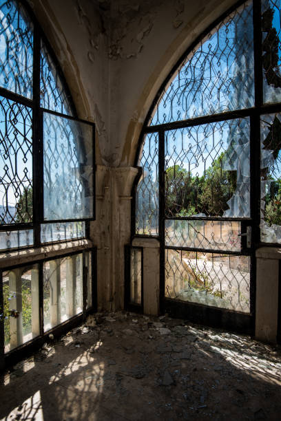 istock Abandoned house room with view through broken windows and doors 1264883594