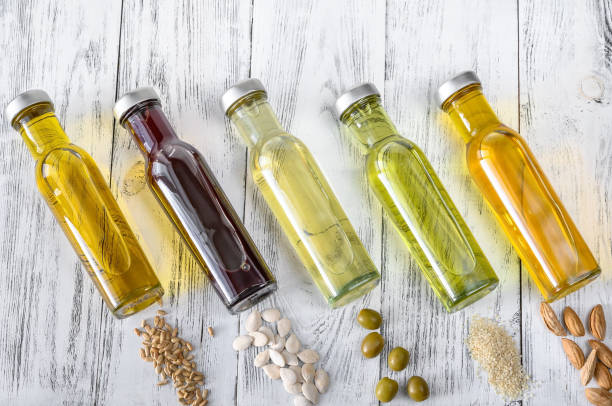 Assortment of vegetable oils Assortment of vegetable oils in bottles bottle of salad dressing stock pictures, royalty-free photos & images