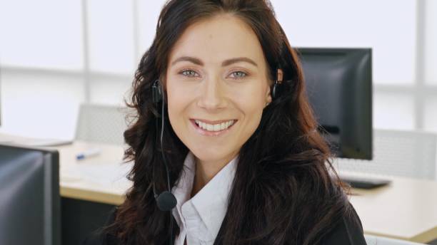 istock Business people wearing headset working in office 1264891120