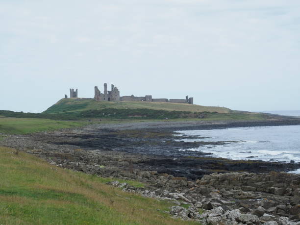 istock Dunstanburgh castle in Northumberland 1264891396