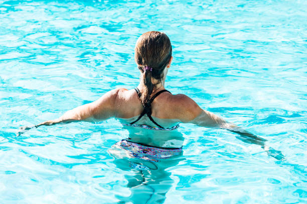 istock Woman on her back in a paradise water pool 1264895457