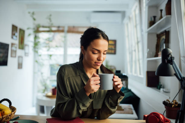 istock Happy young mixed race woman working from home 1264901287