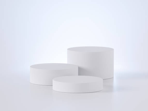 istock 3d render, white modern minimal background with three vacant pedestals. Commercial showcase blank mockup with empty podium for product displaying 1264903359