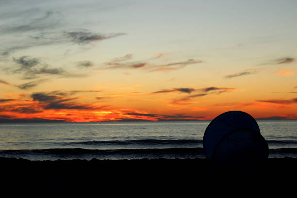 istock Sunset by the sea. 1264906275