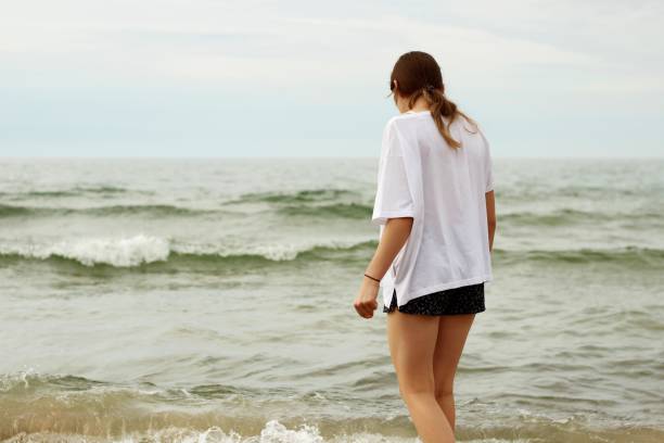 istock Girl on the beach. 1264906399
